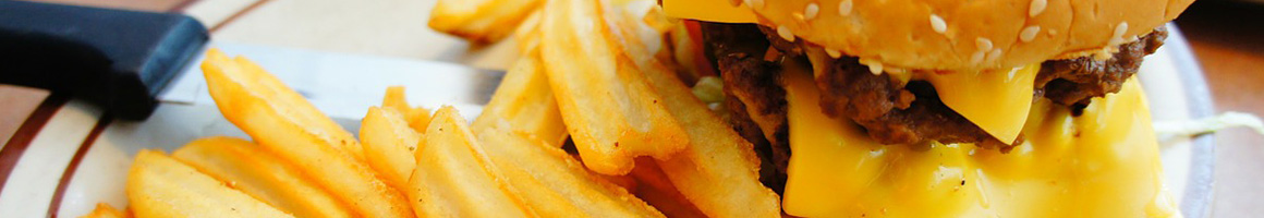 Eating American (Traditional) Burger at Bulldog Burger Bistro restaurant in Fresno, CA.